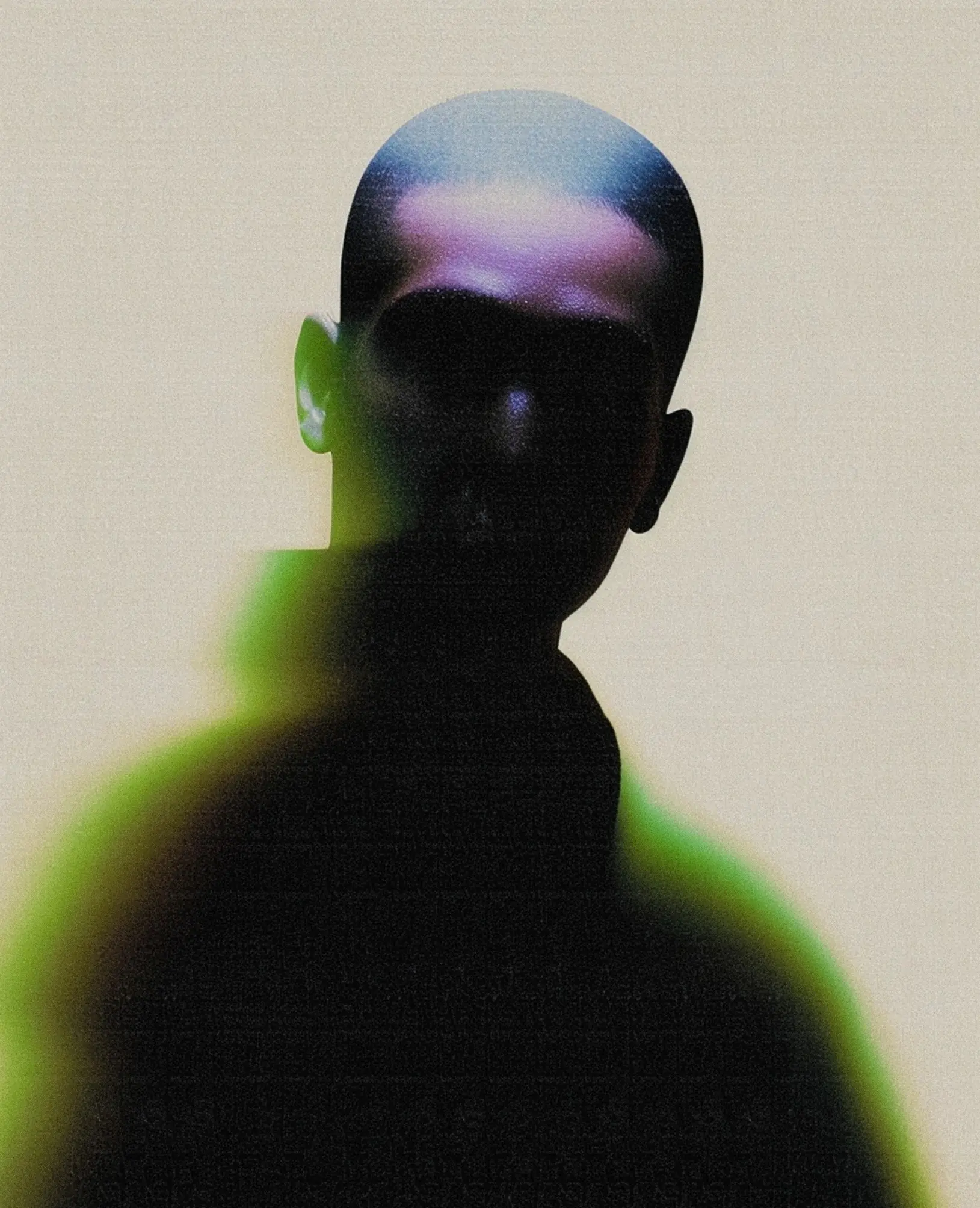 Silhouetted artist with green & violet light